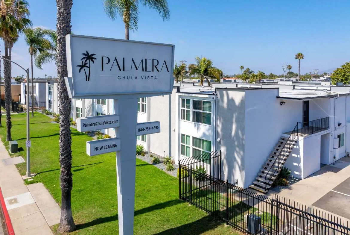 Palmera entrance sign and renovated apartment exterior